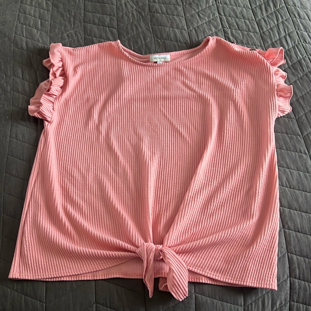 Pink ruffle sleeve shirt.